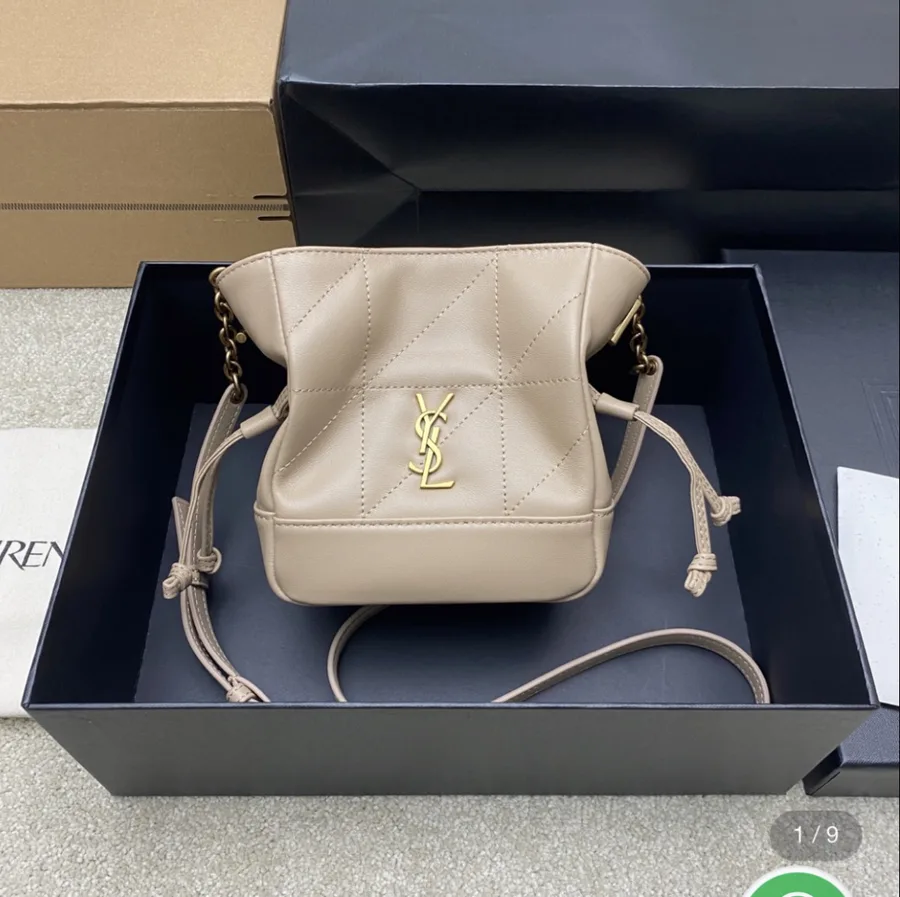 Saint Laurent Jamie mini shoulder pouch in beige lambskin leather.