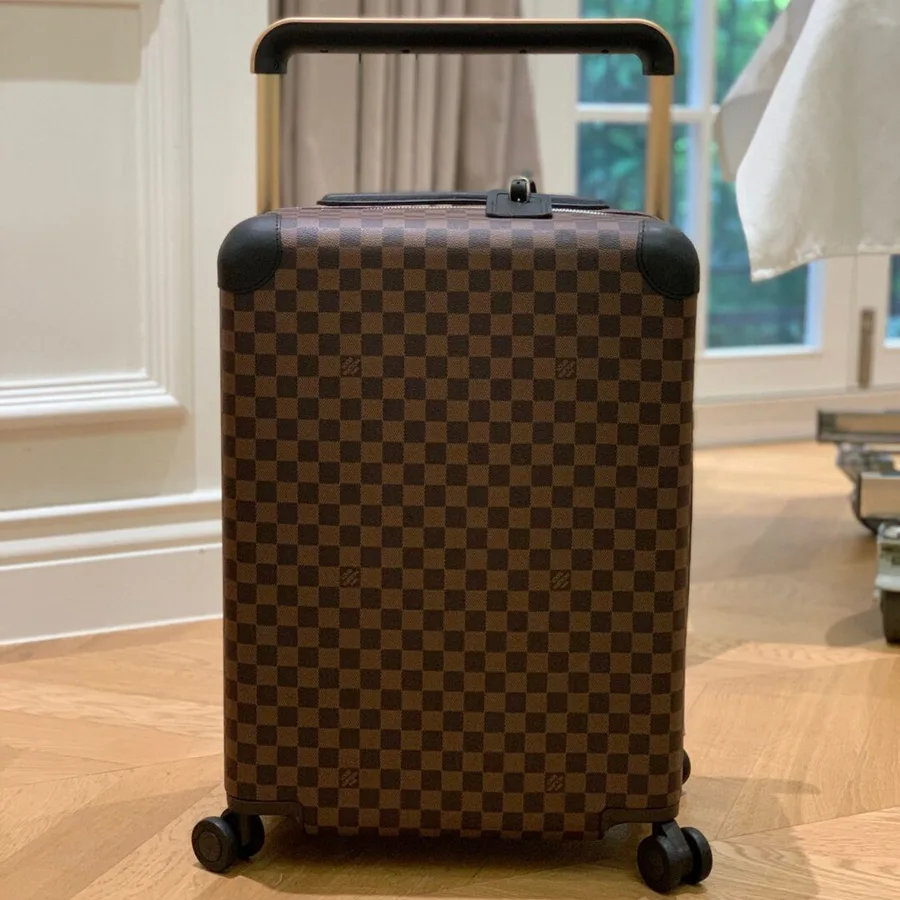 Louis Vuitton Horizon 55 rolling suitcase in Damier Ebene canvas.