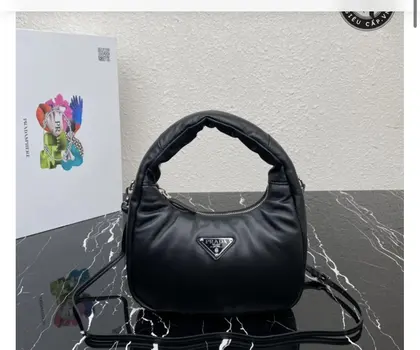 Prada Soft Padded Nappa Leather Mini Bag in black — Prada Handbags sample